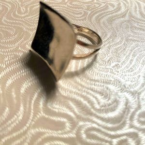 Sterling Silver tray style ring. It’s marked 925